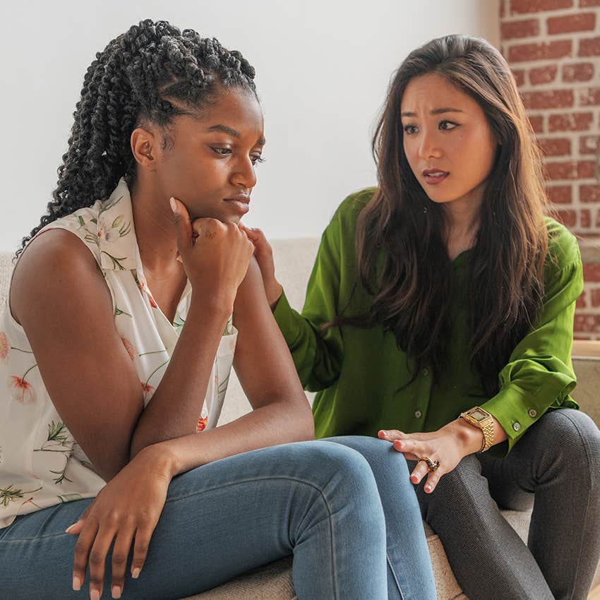 two women having a serious conversation in a mature way