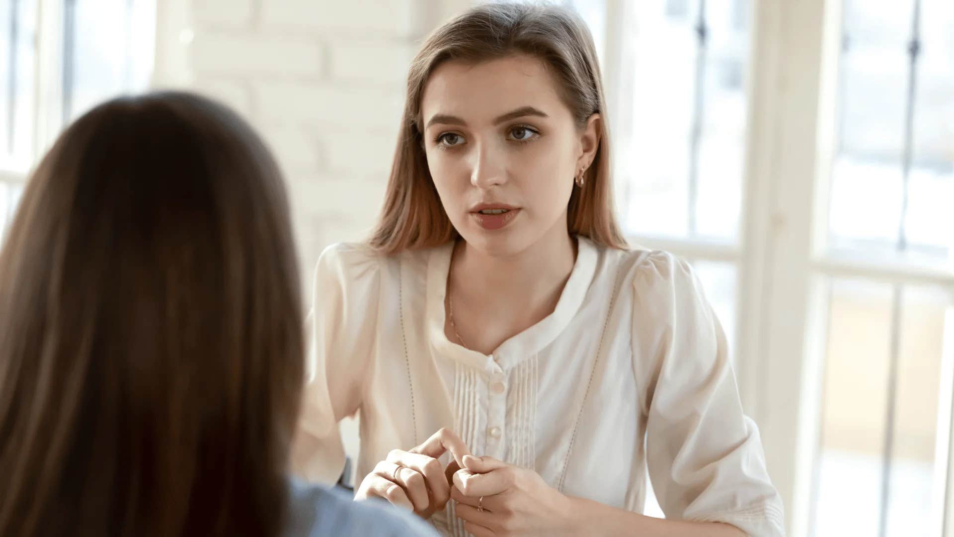 intelligent woman resolving conflicts calmly with colleague