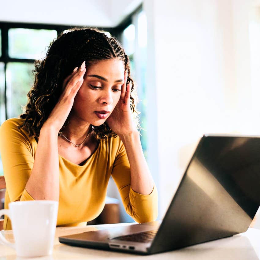 stressed woman dealing with imposter syndrome at work