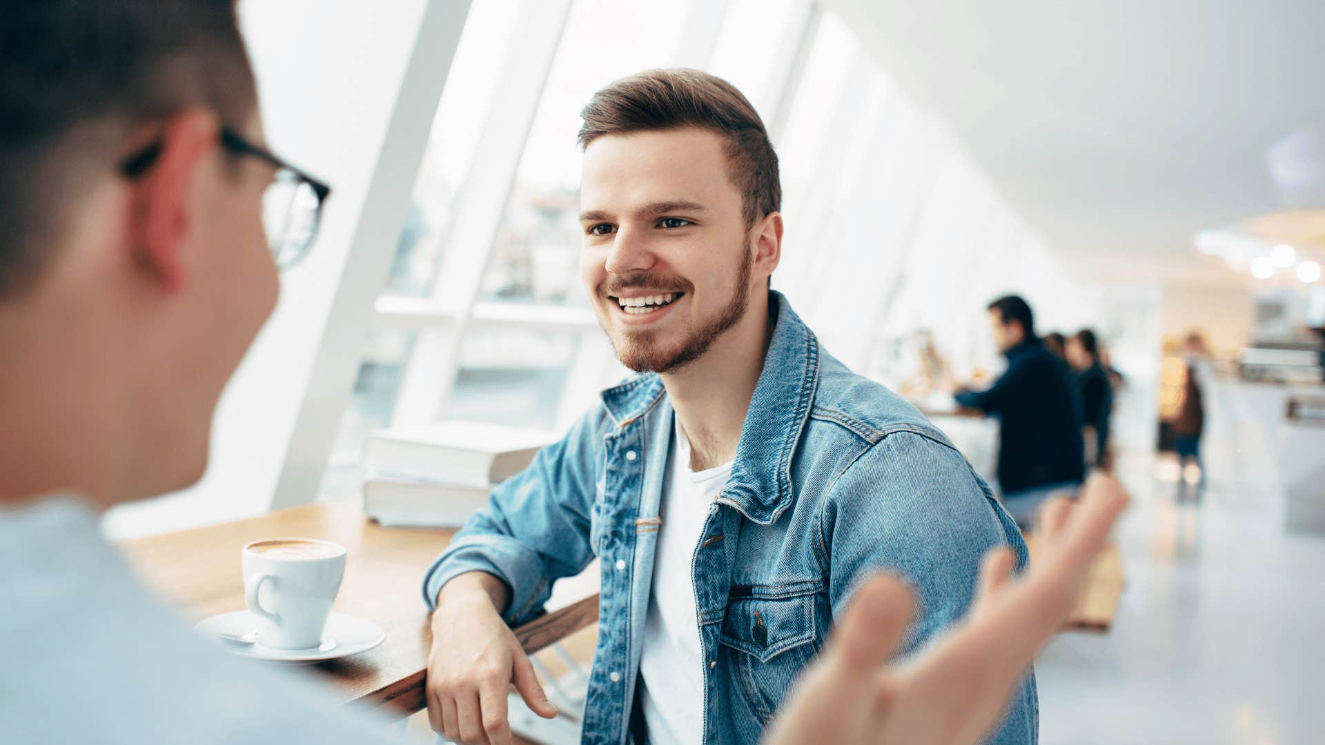 man engaged in a deep conversation with friend