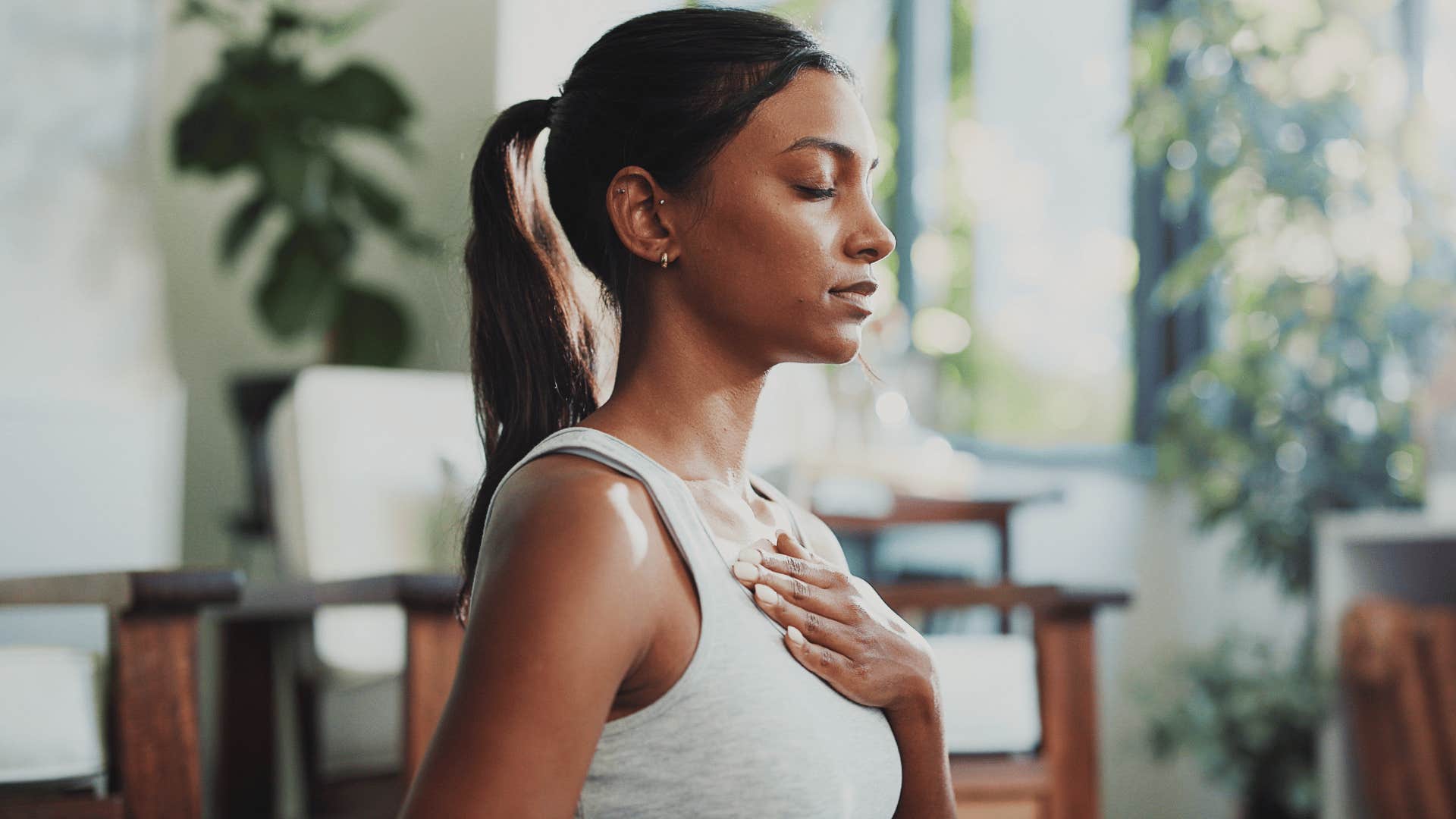 peaceful woman meditating and breathing