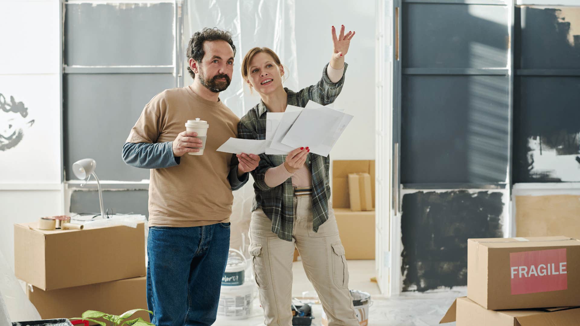 happy couple decorating their home