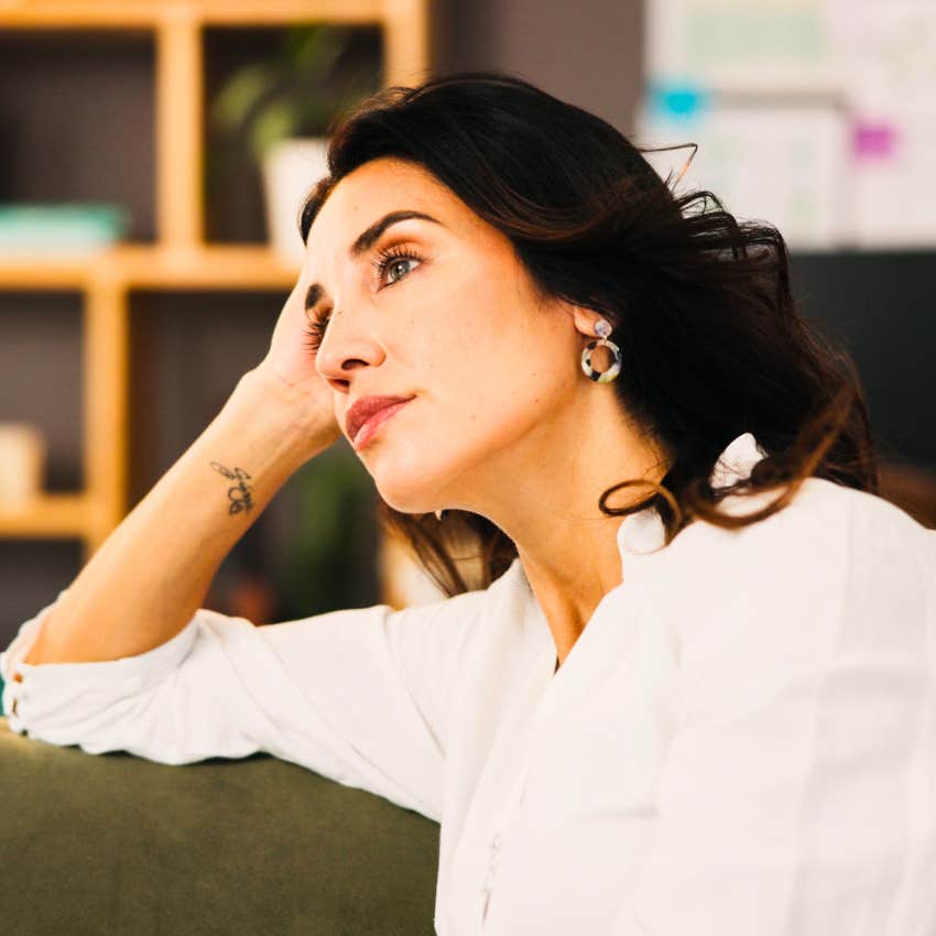 woman sitting alone guilting herself
