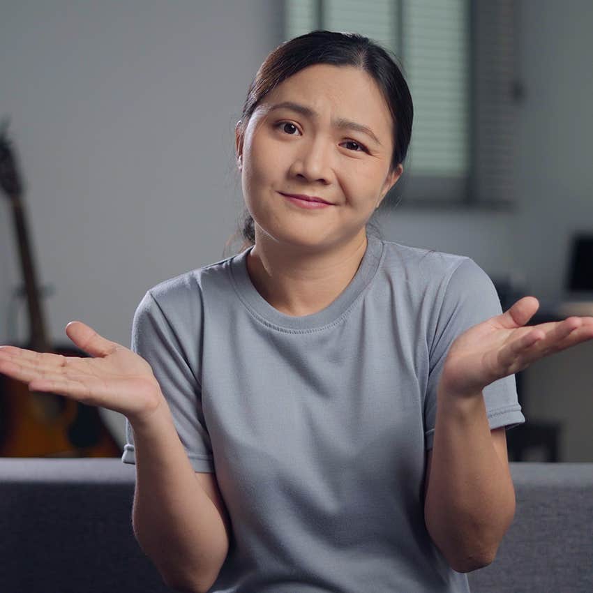 intellectually curious woman shrugging doesnt know
