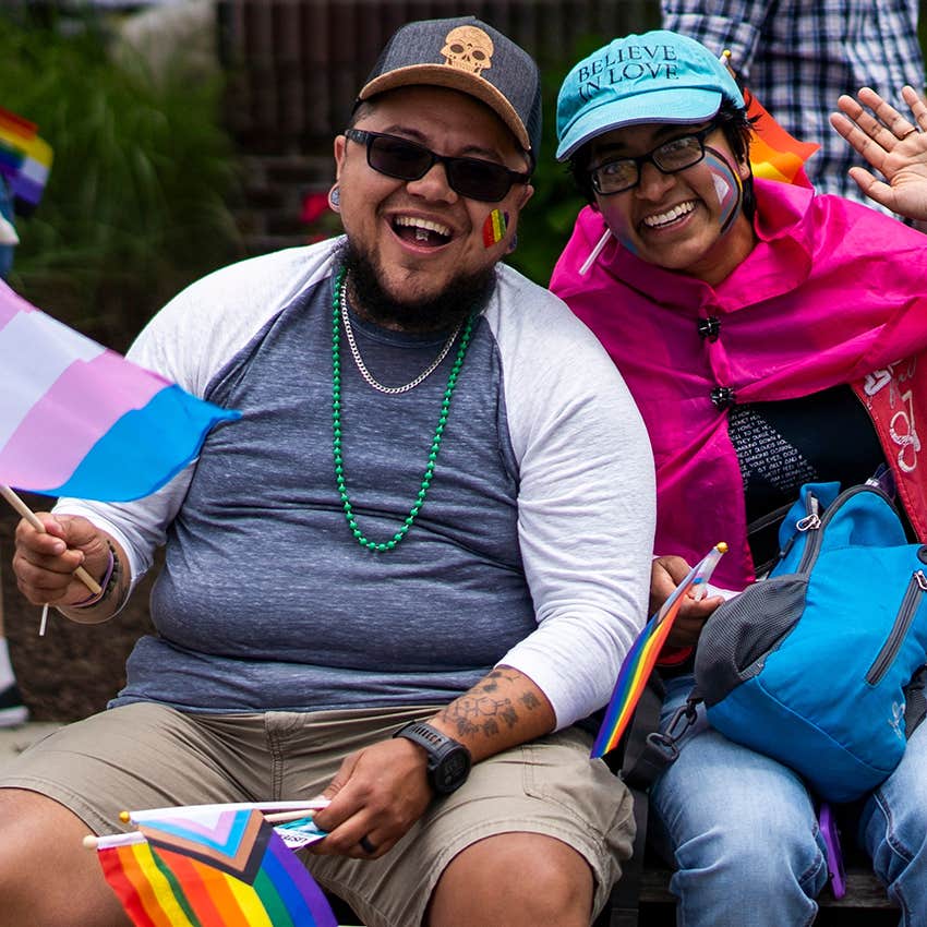 supportive dad and adult daughter celebrating pride together