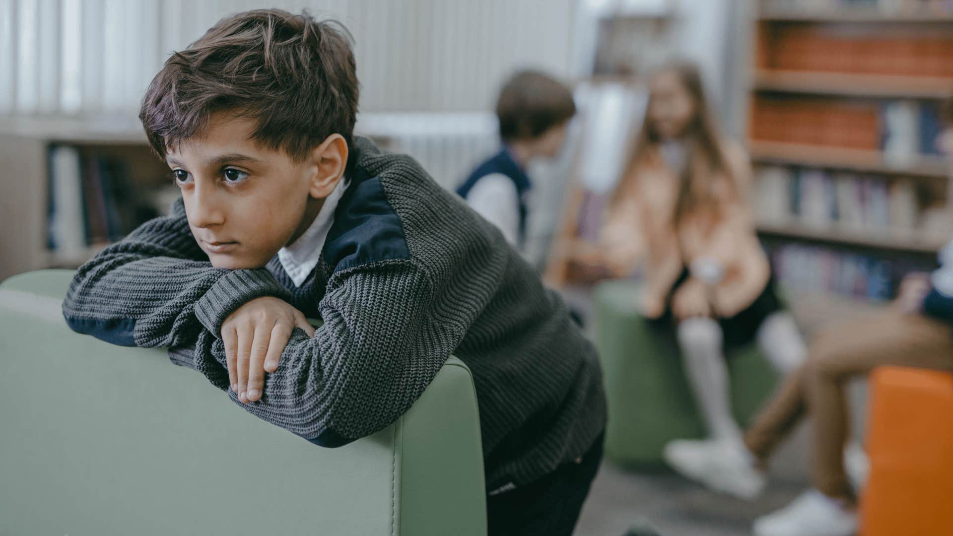 kid looking grumpy waiting watch his favorite show