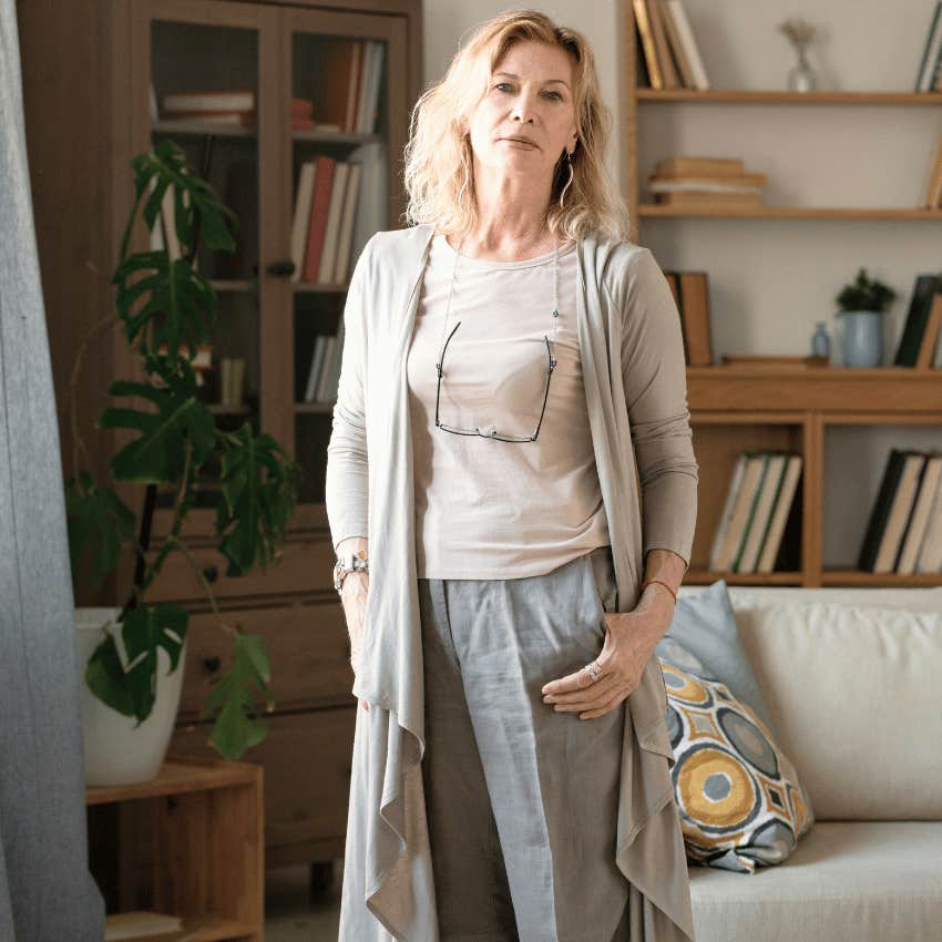 middle age woman standing in living room