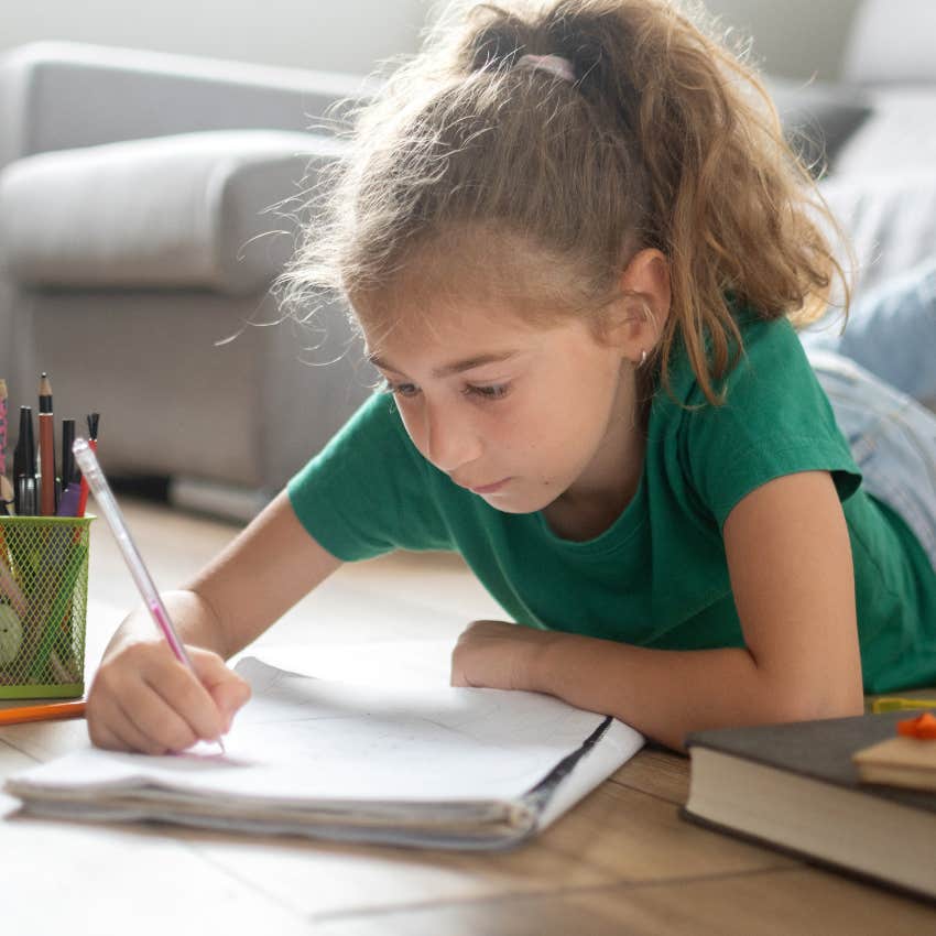 millennial kid writing a letter