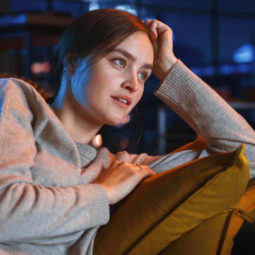 young woman watching america's next top model feeling invested