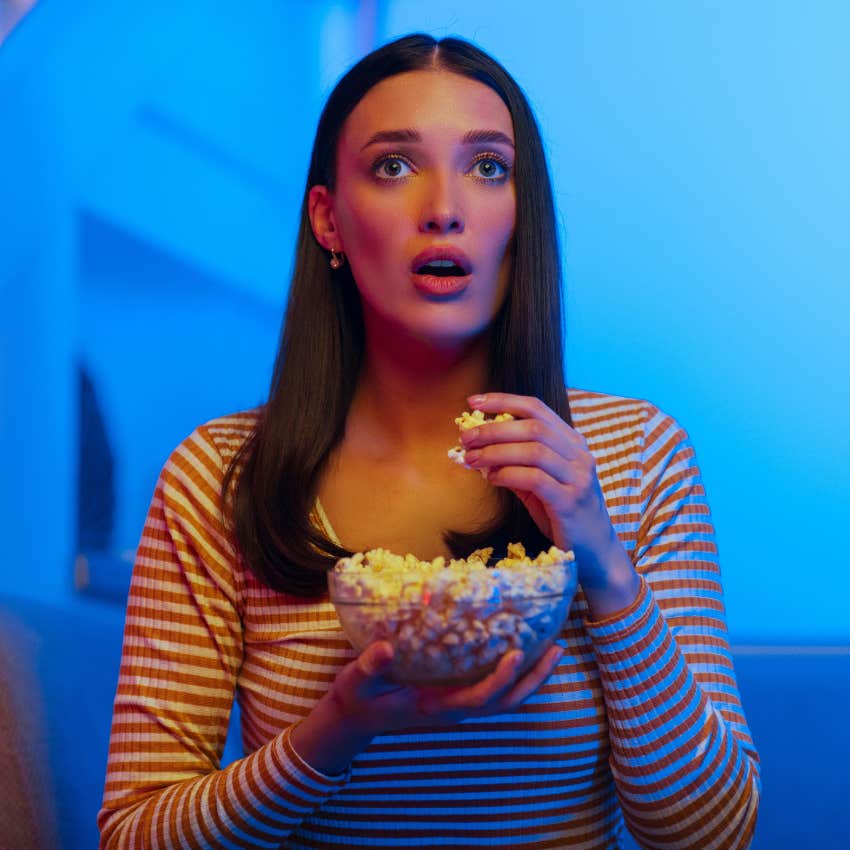 millennial woman watching dance moms feeling shocked