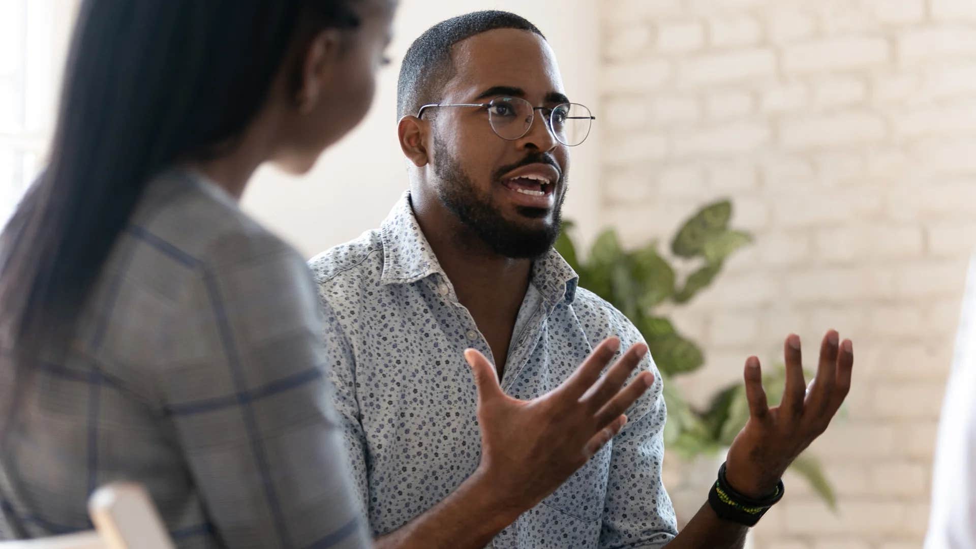 millennial man speaking up for himself at work