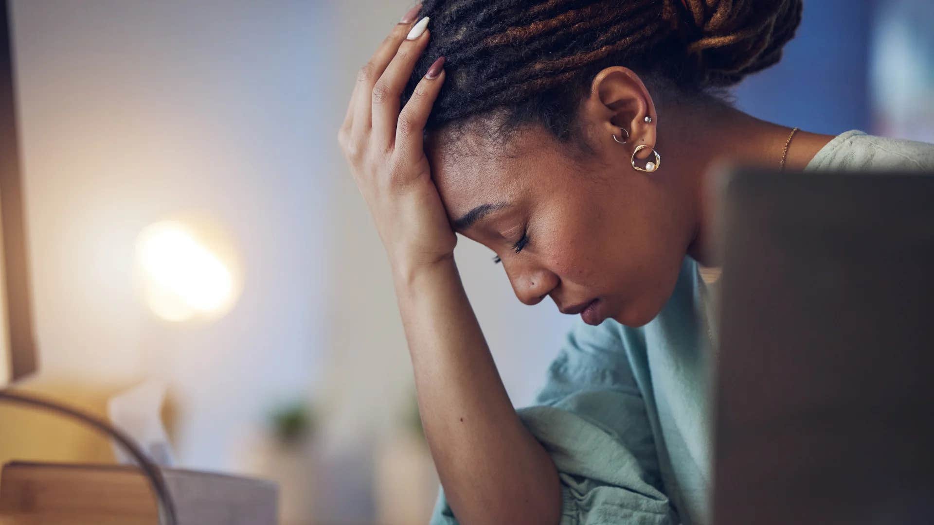 stressed millennial woman working in unhealthy environment