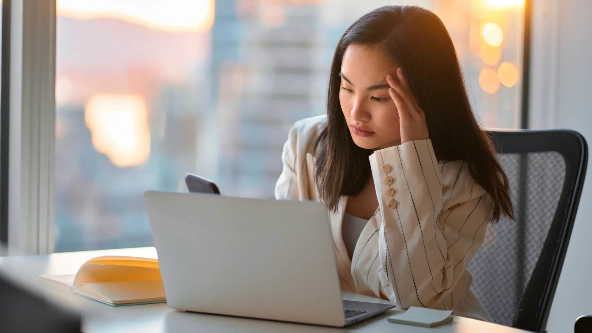 stressed millennial woman in the office who wants to work from home