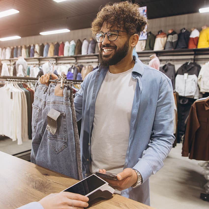 man purchasing clothes because he thinks they'll solve his problems