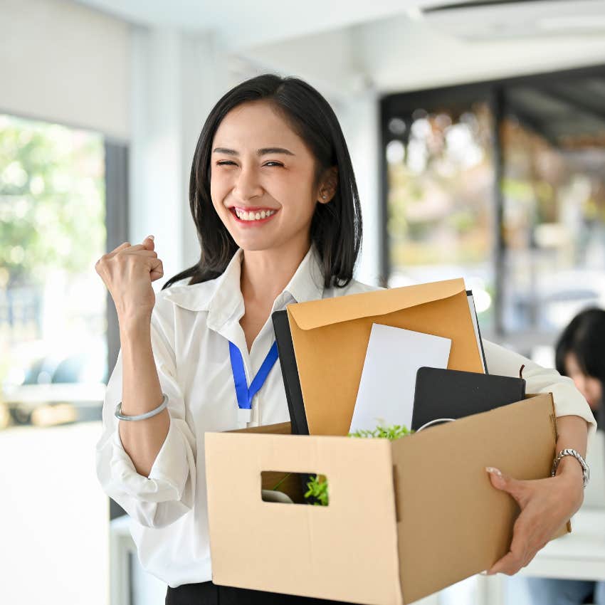 young working woman excited to leave job after resigning