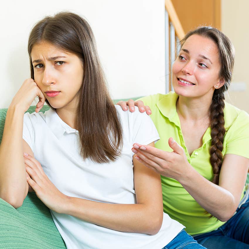 smiling narcissist talking to upset friend