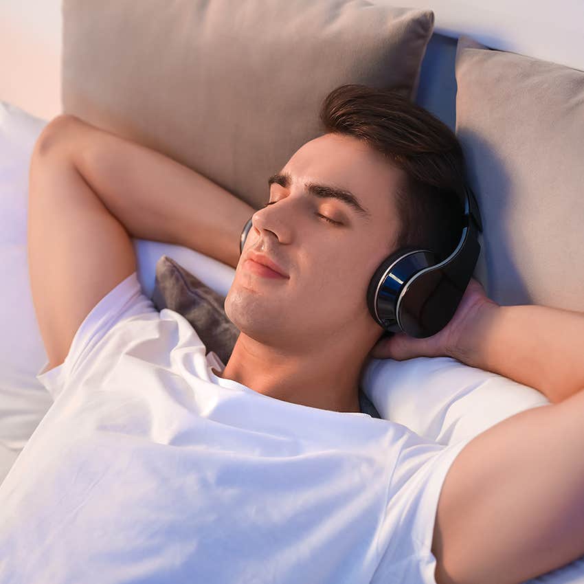 man listening to nature sounds before sleep