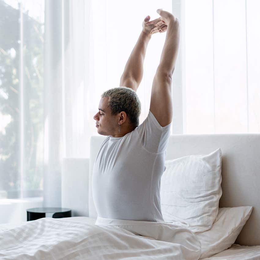 man waking up well rested