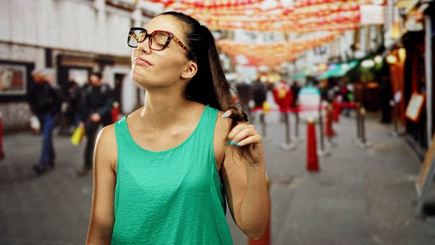 woman constantly plays with her hair