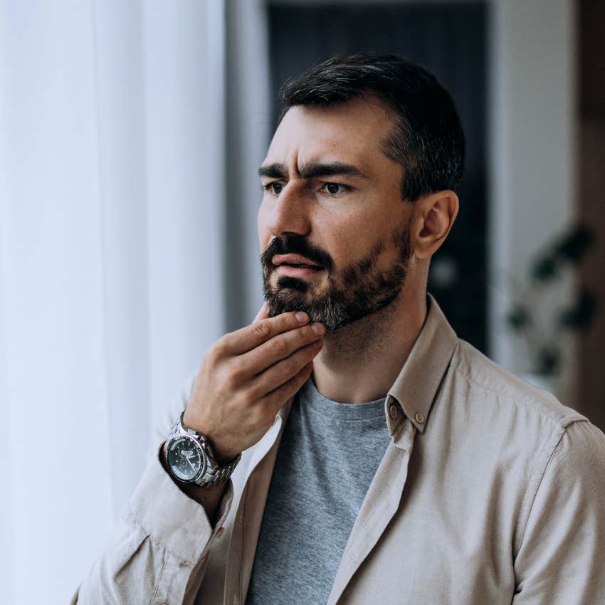 Man who thinks change is dramatic looking upset at home.