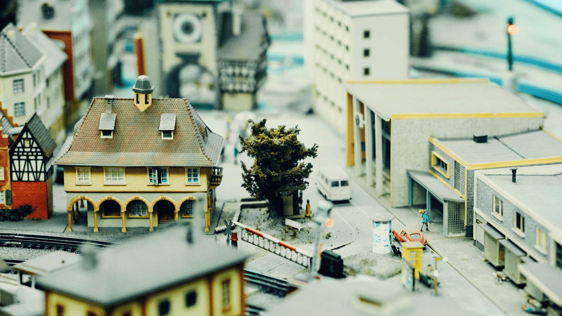 person building models as they build model of town