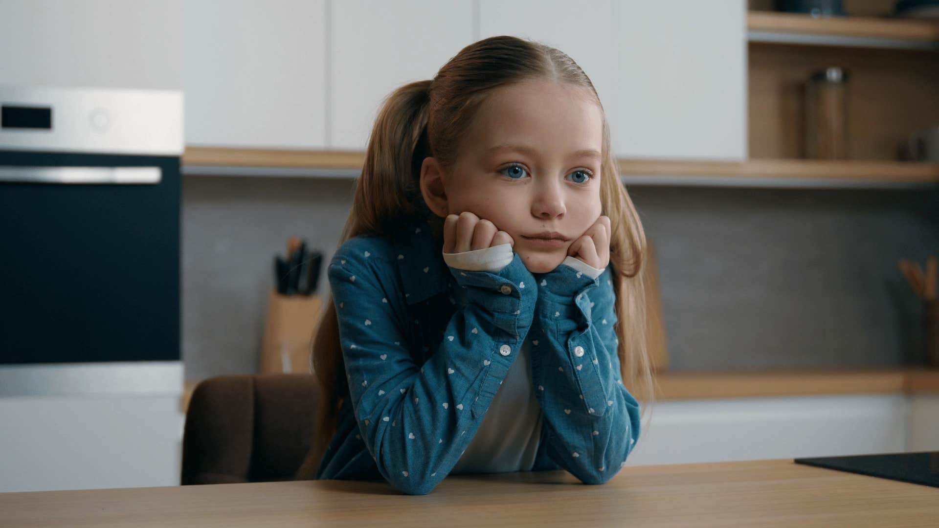 neglected little girl staying quiet alone at home