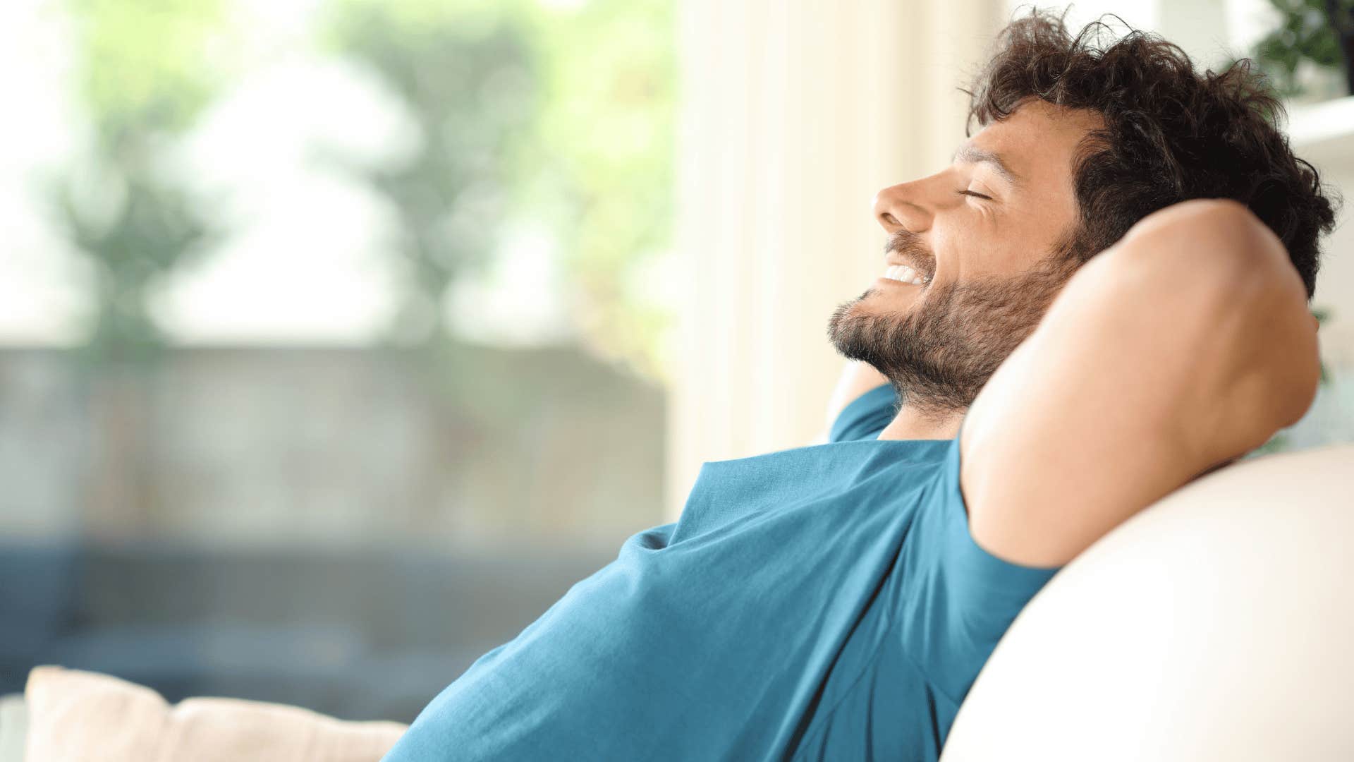 man in blue shirt laying back relaxing as he thinks i don't feel like it