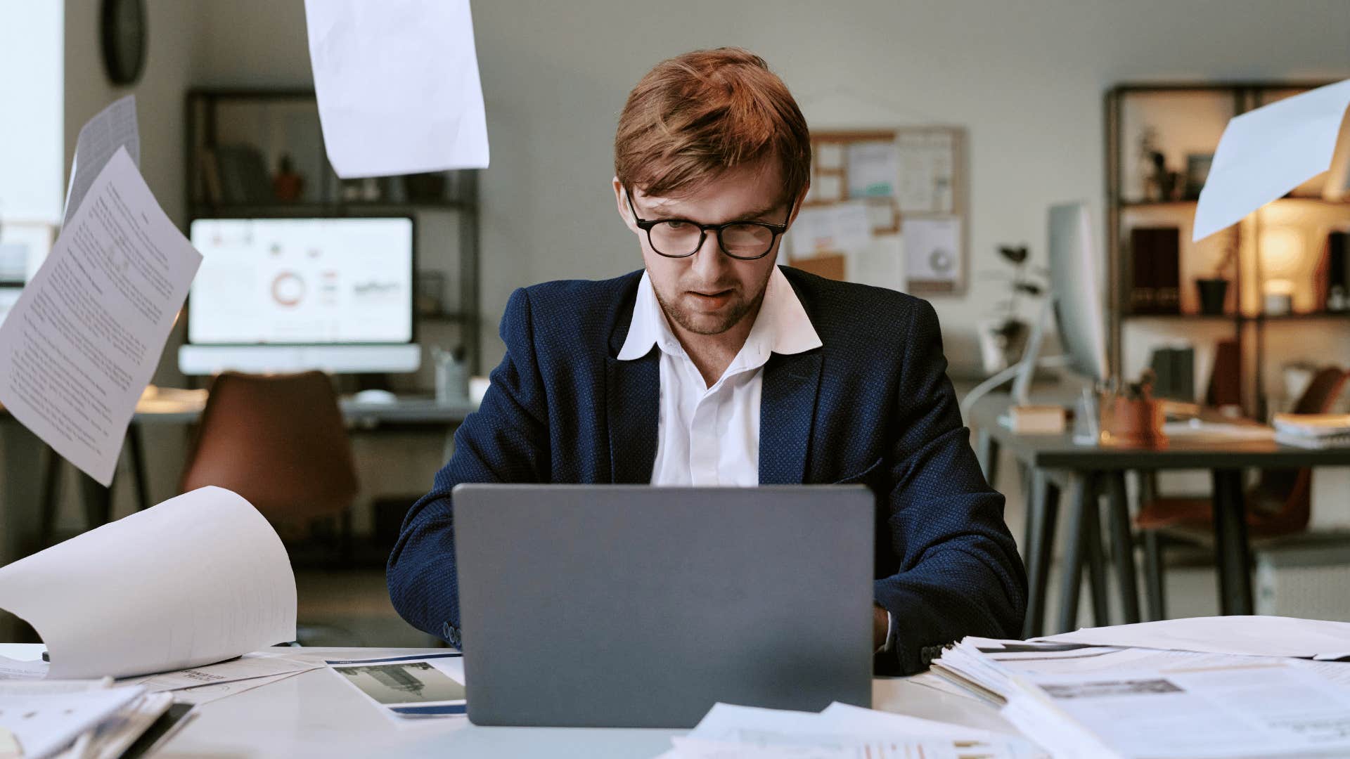 man in professional suit working quickly as he thinks i work better under pressure