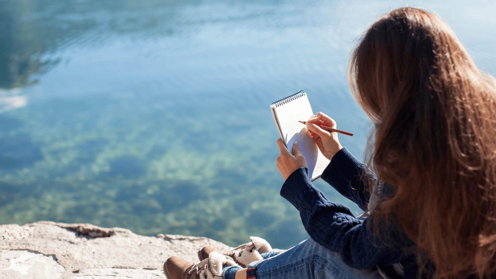 woman sketching new scenarios and places outside