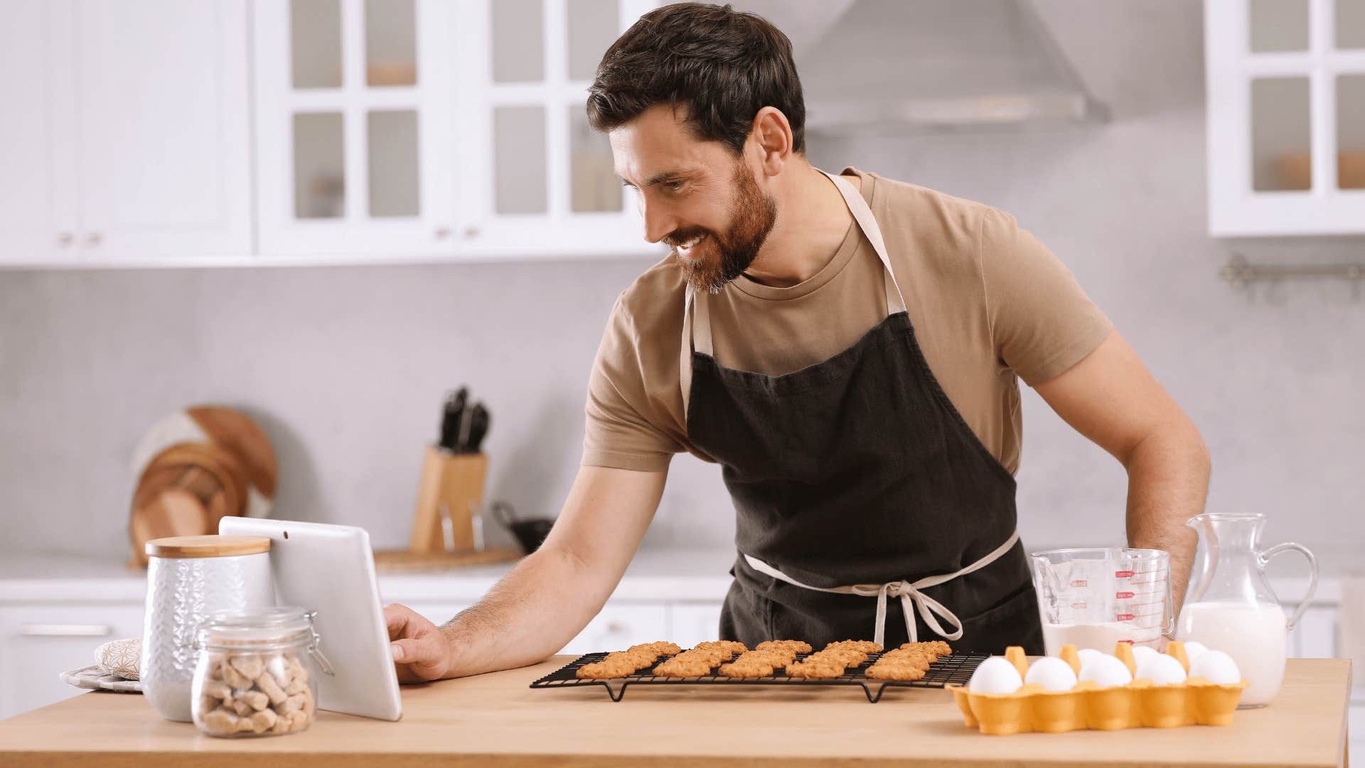 man baking in kitchen as he is trying out new recipes for fun