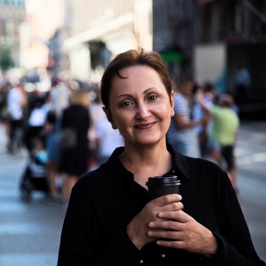 Woman who knows that people associate black clothes with intelligence.