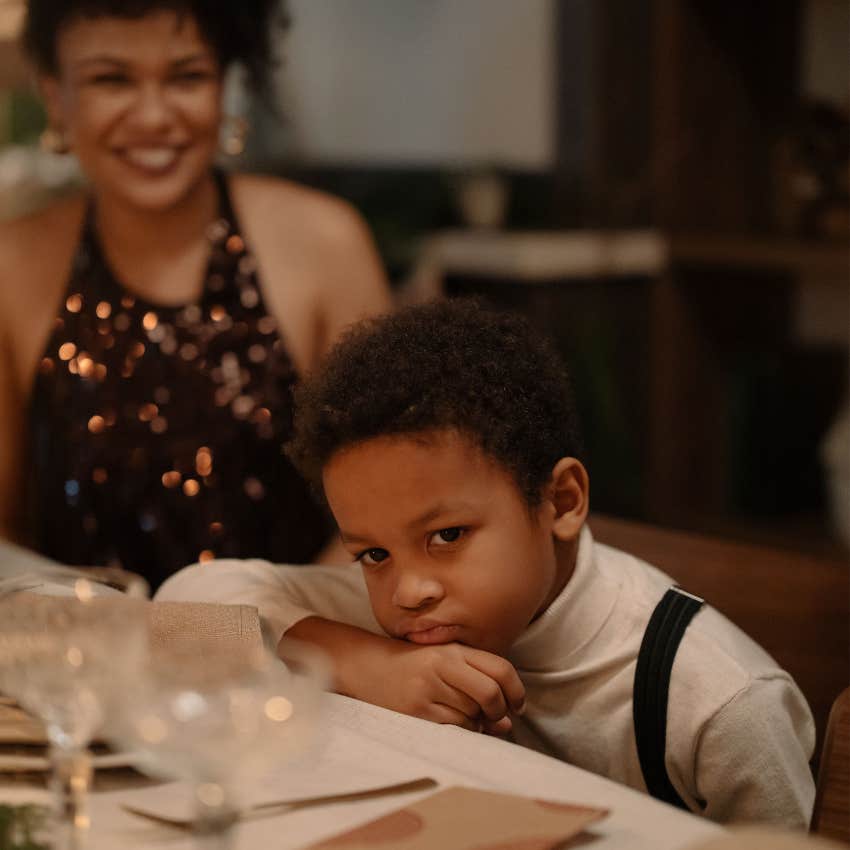 Young child sitting quietly while the rest of the family focuses on someone else's needs