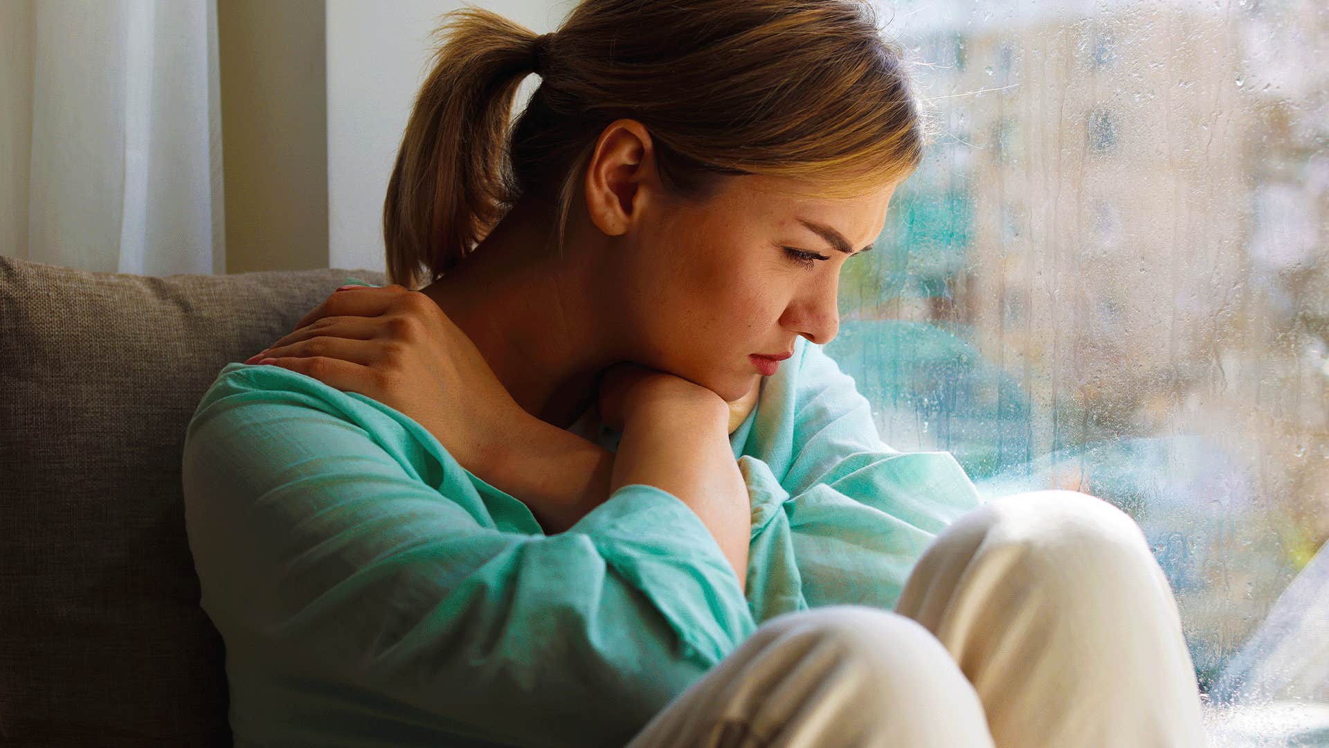 woman holds herself back because she doesn't believe she's worth the effort because she felt like a burden growing up