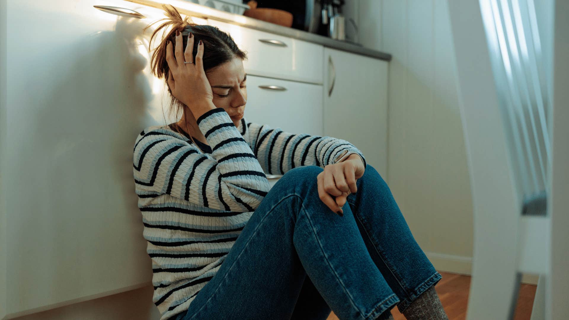sad woman crying alone at home