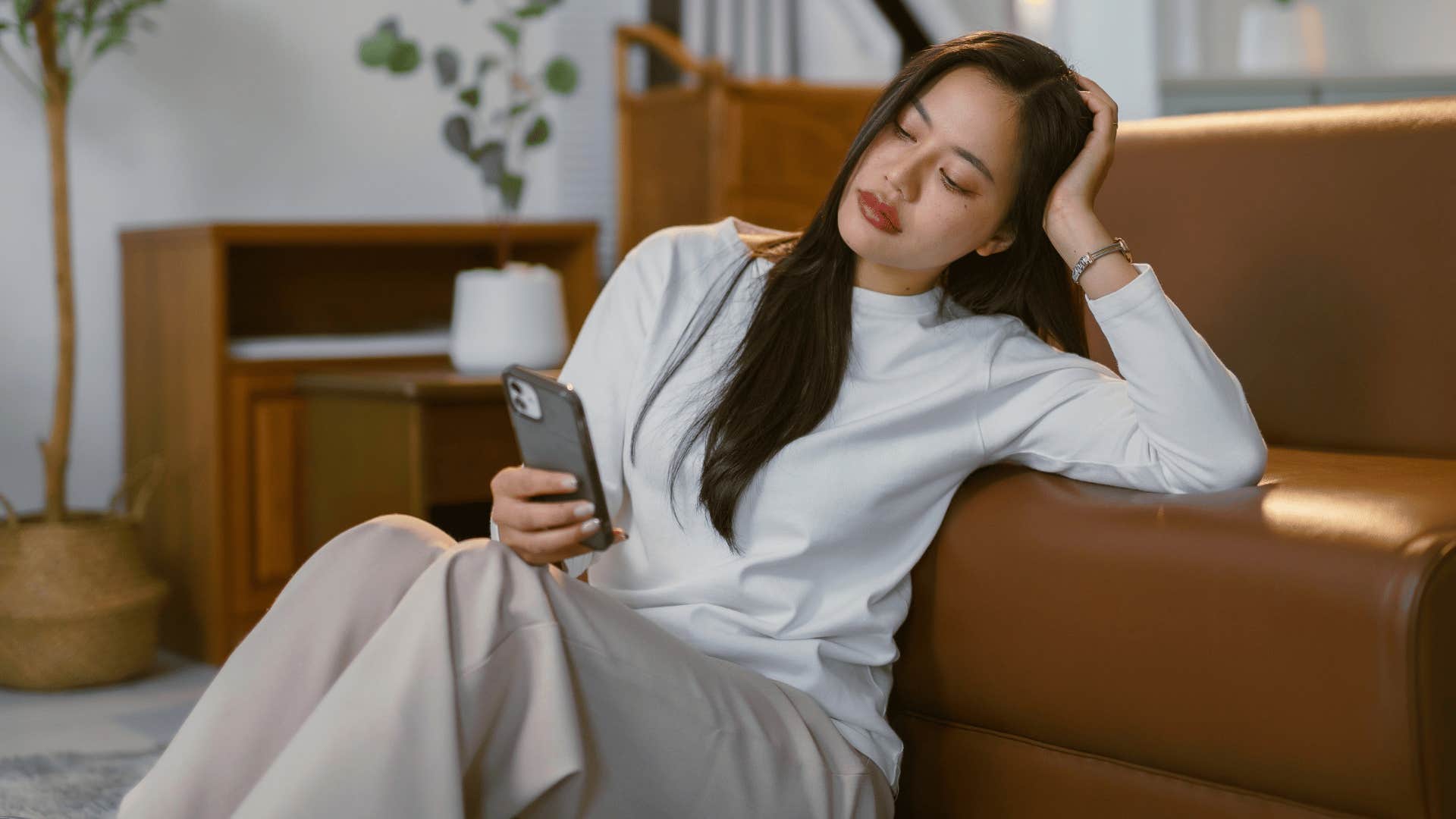 sad woman scrolling endlessly on social media