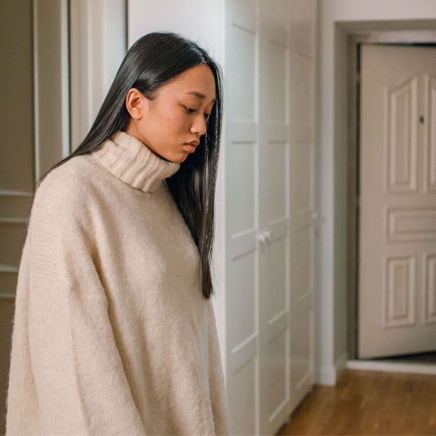 party guest hesitating by the door because she overthinks social interactions