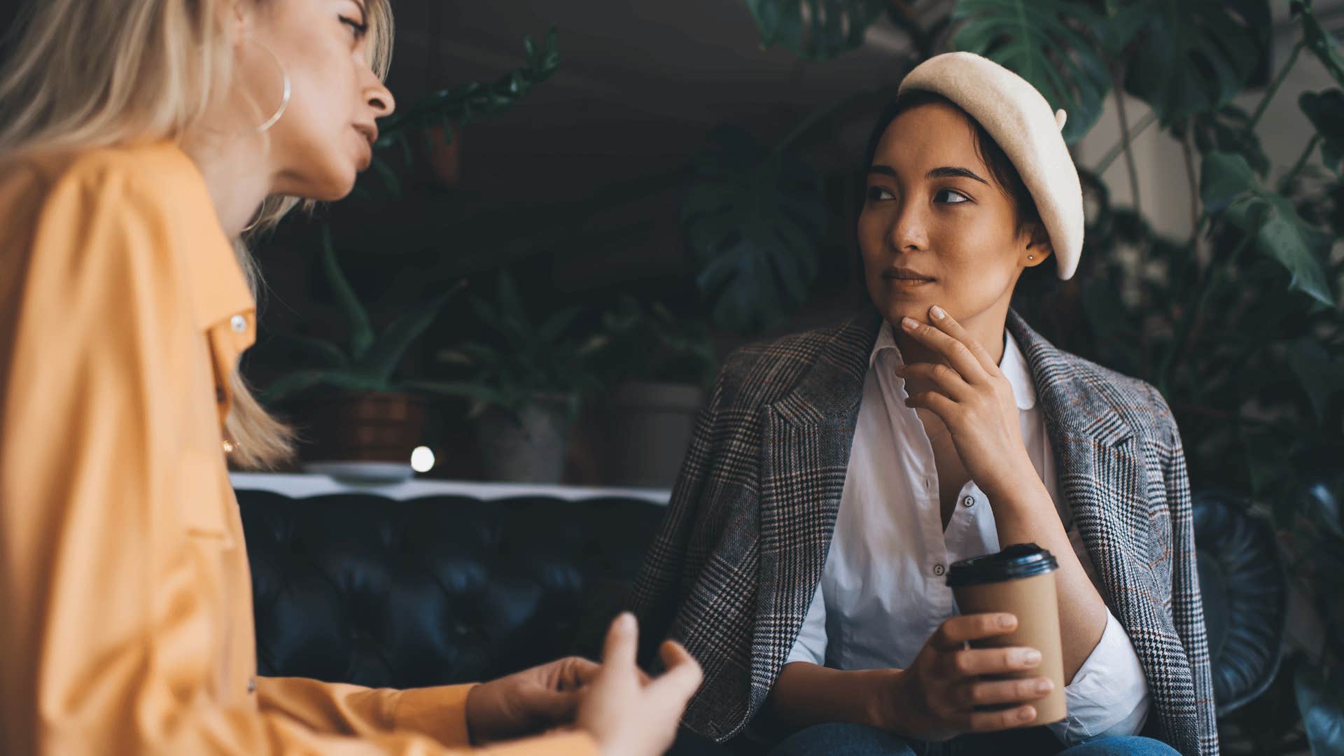 woman staring at friend deep in thought as she says i get where you're coming from