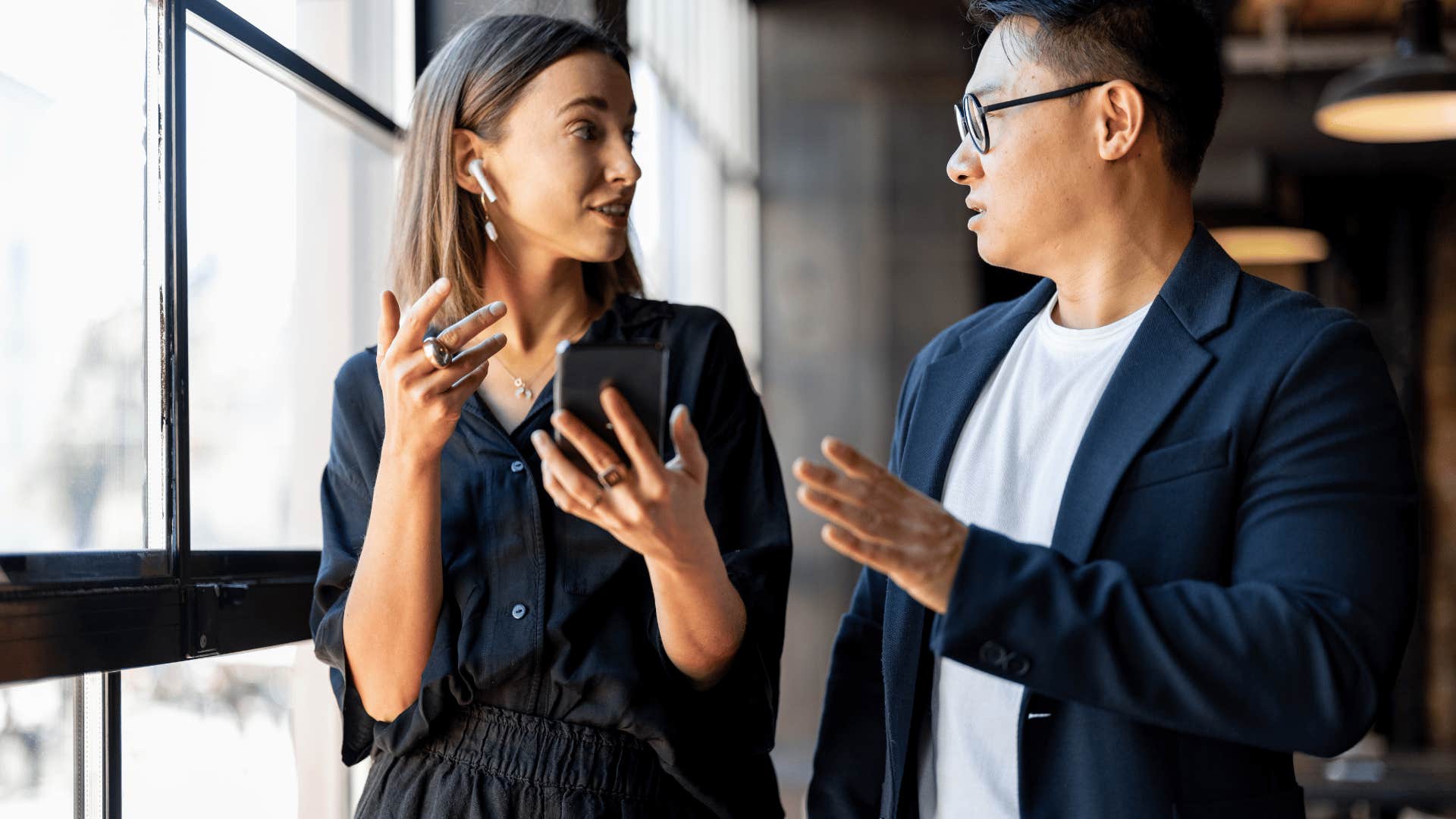 woman in black shirt telling man i might've misunderstood