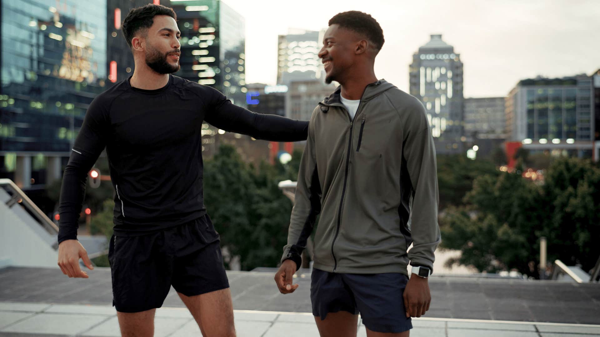 man in black shirt and shorts comforting friend as he says take your time