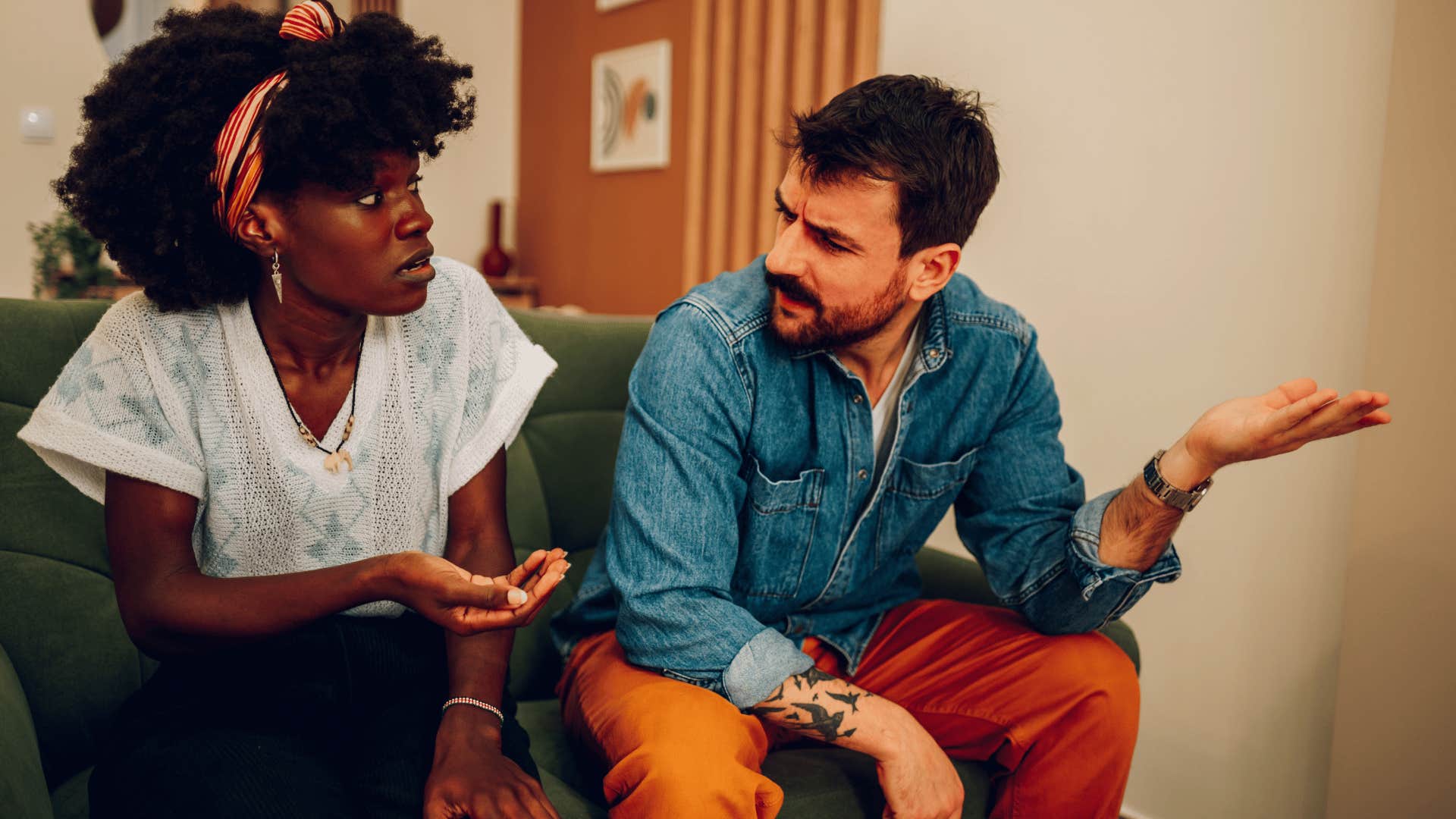 couple arguing with cruel man telling woman to get over it