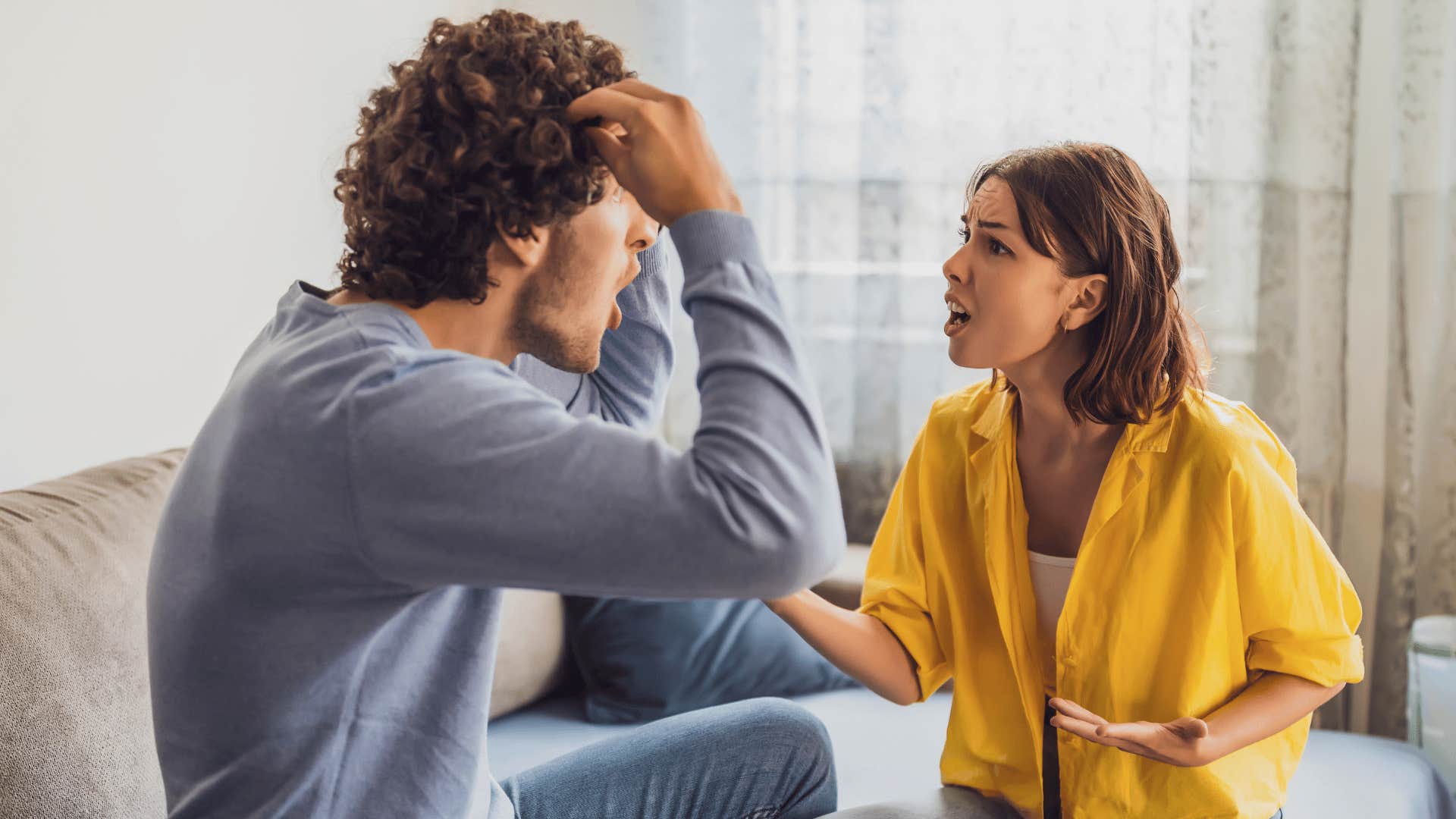 woman in yellow sweater arguing with man as she says if you really cared you'd