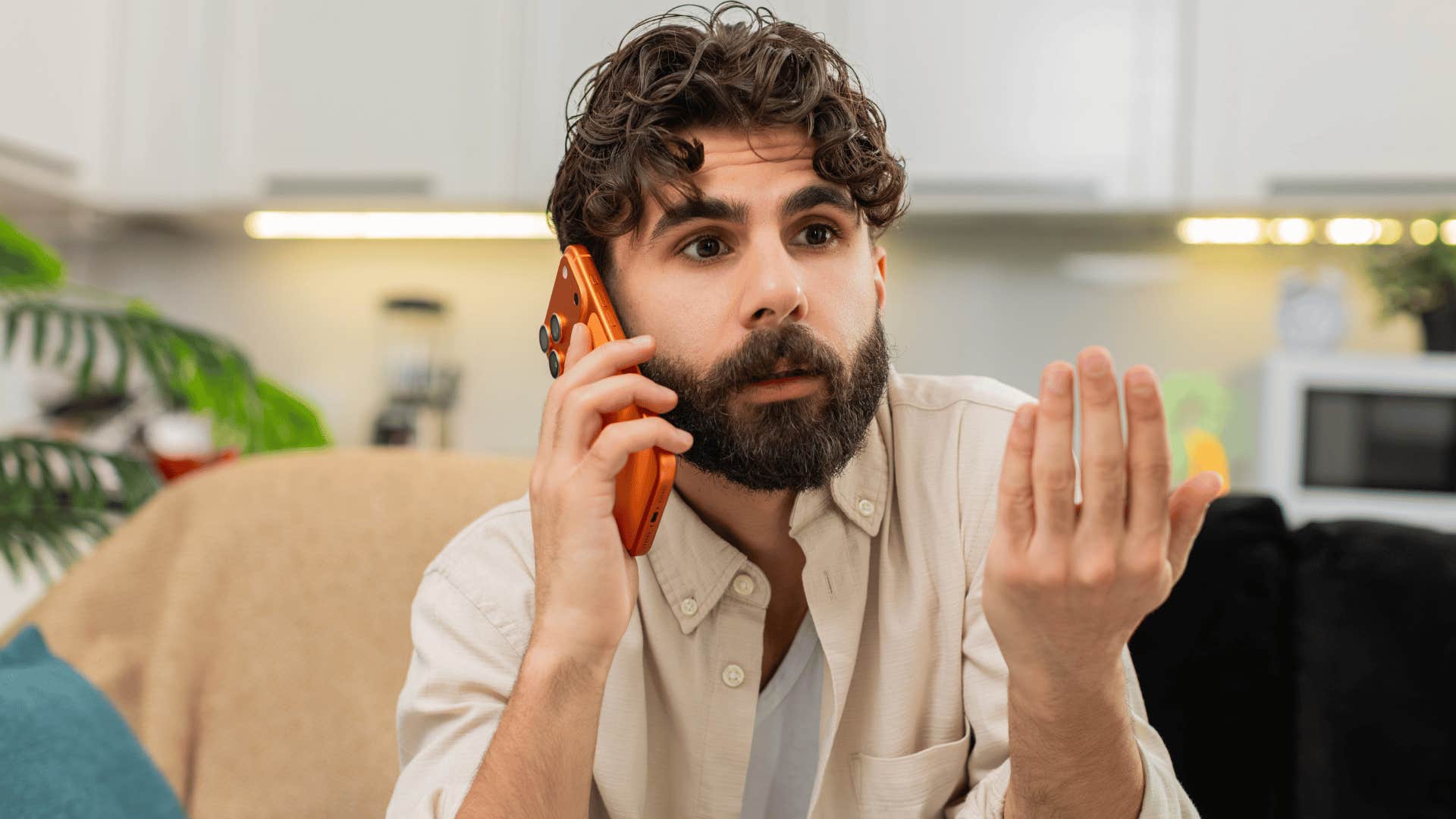 man on phone arguing as he says you owe me