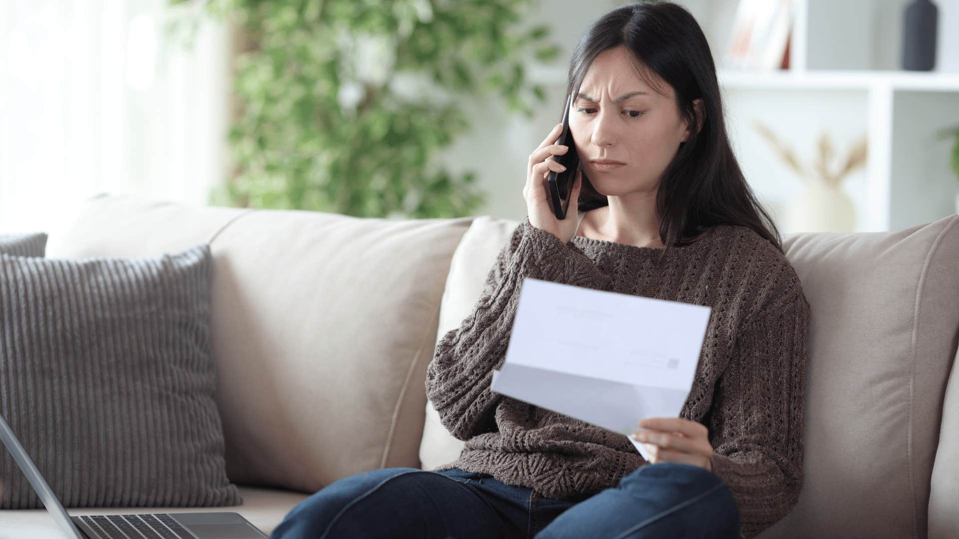 woman in brown shirt on phone looking at paper as she says i've always done it this way