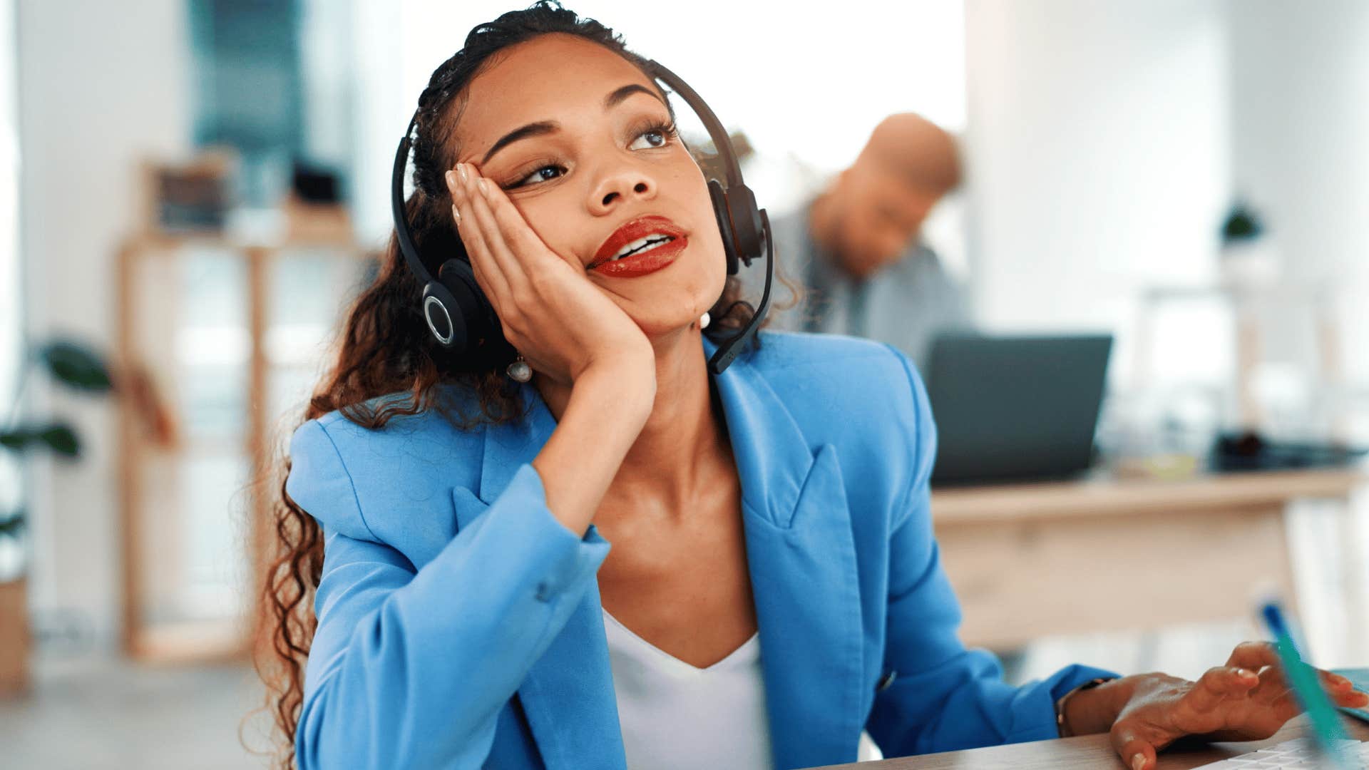 woman with blue jacket annoyed at work thinking i thought it was obvious