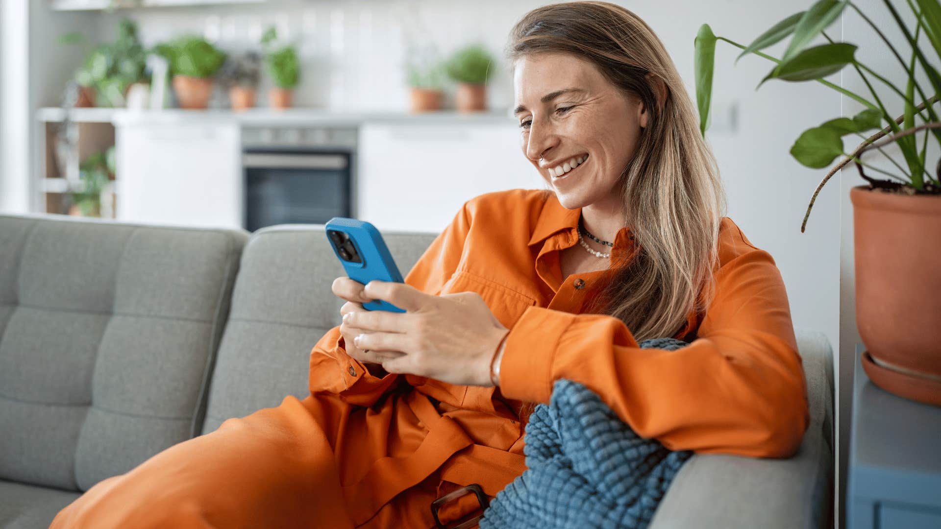 woman smiling posting photos of friends online with no permission