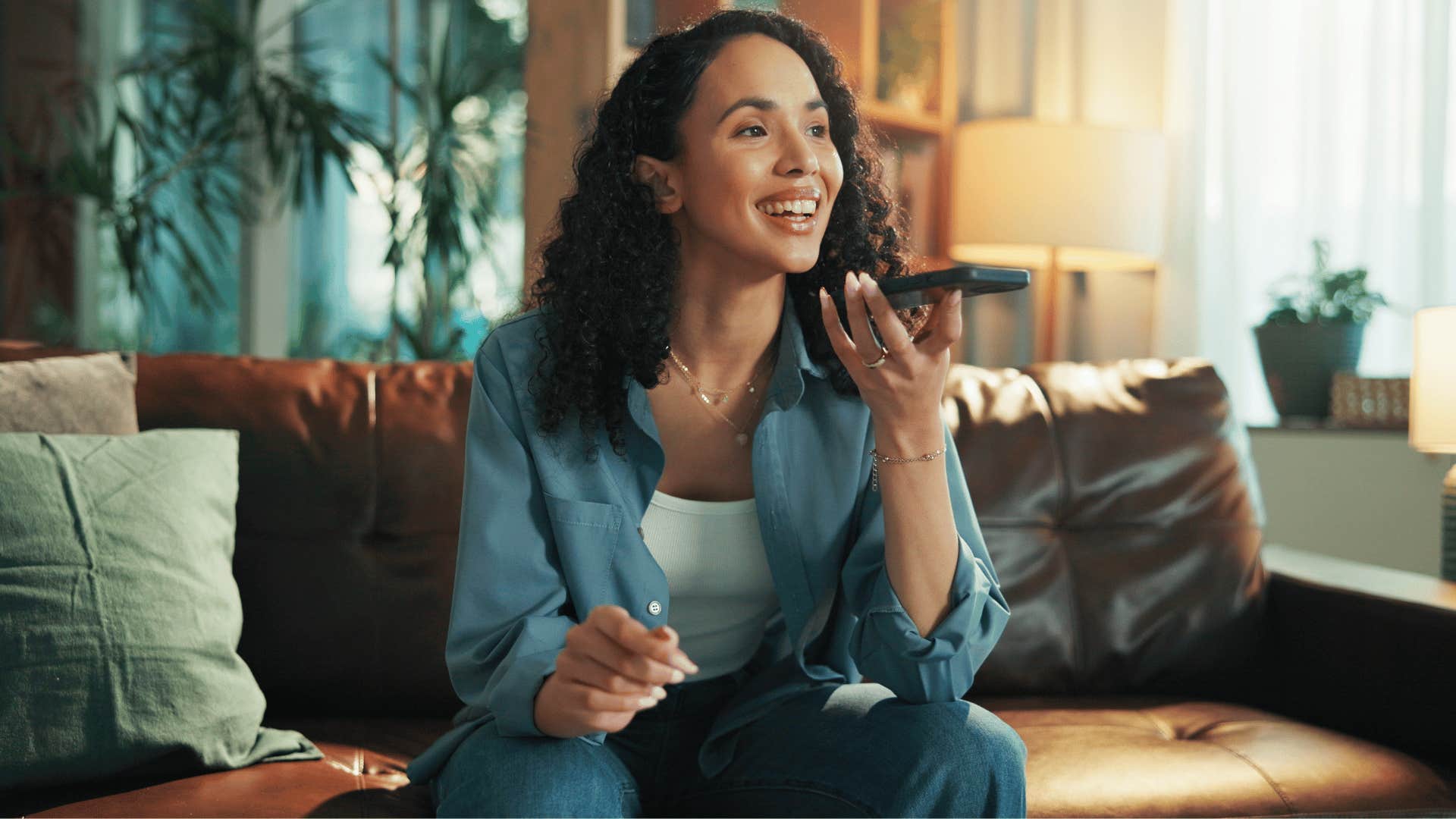woman putting friend on speakerphone without telling them