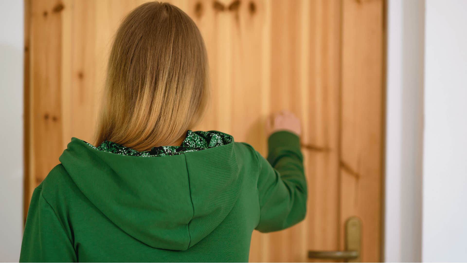 woman knocking on the door showing up unannounced
