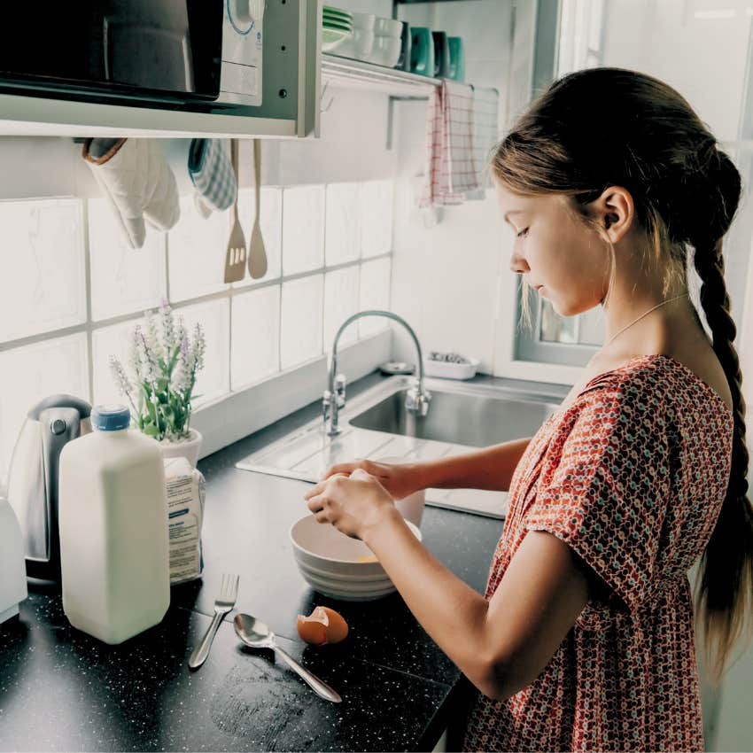 independent young girl cooking for herself and her family