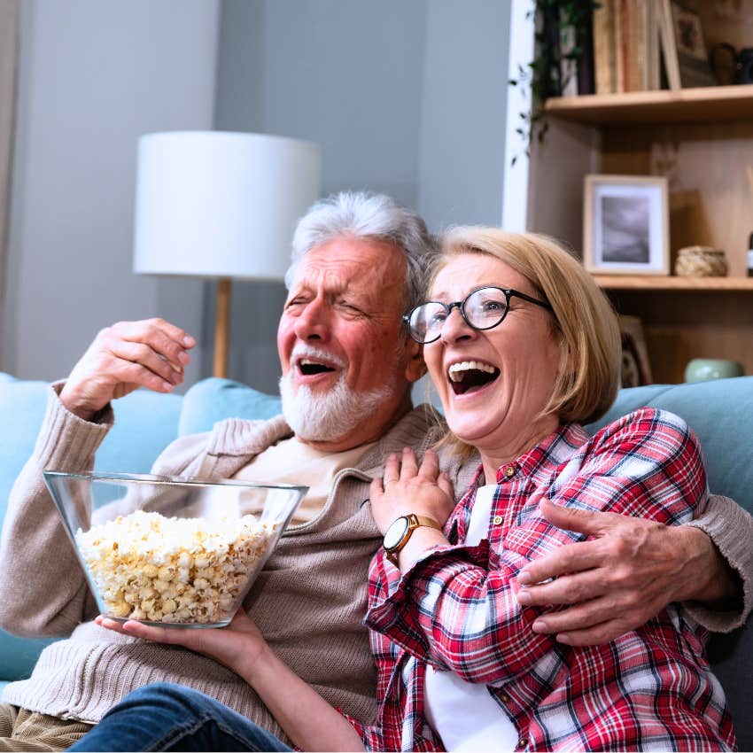 older couple watching cable TV at home