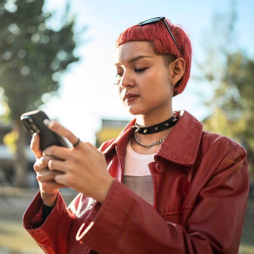 Gen Z woman trying to be unique on her phone.